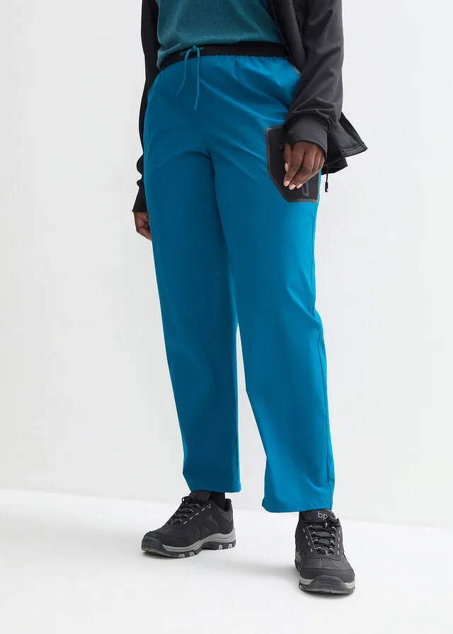 Pantalón elástico en 4 direcciones con material impermeable y bolsillos Negro