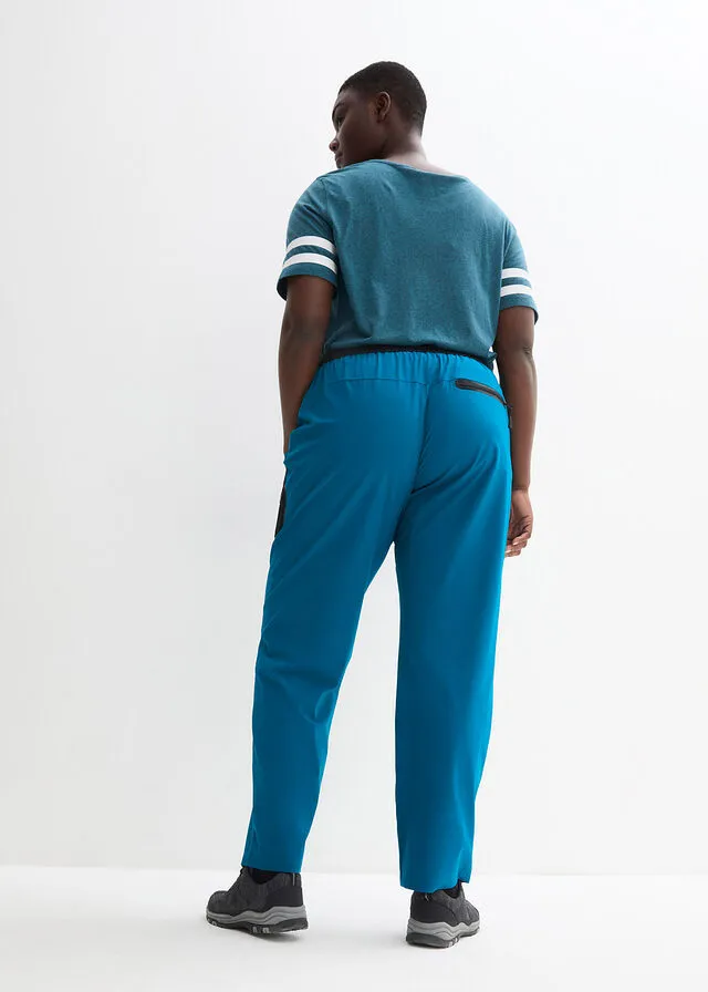 Pantalón elástico en 4 direcciones con material impermeable y bolsillos Negro