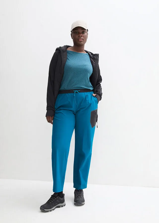 Pantalón elástico en 4 direcciones con material impermeable y bolsillos Negro