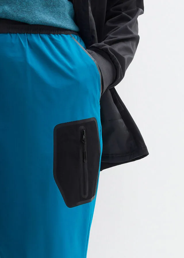 Pantalón elástico en 4 direcciones con material impermeable y bolsillos Negro