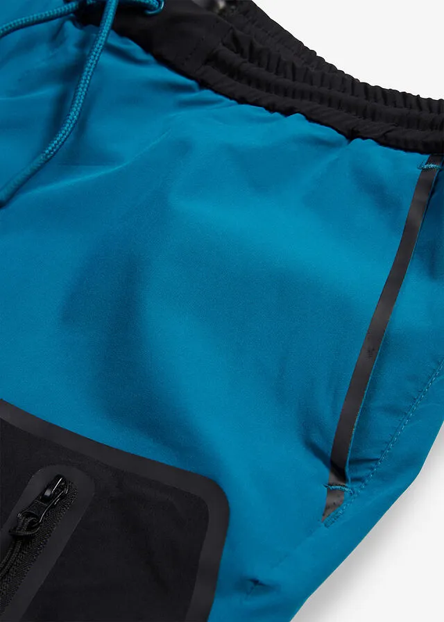 Pantalón elástico en 4 direcciones con material impermeable y bolsillos Negro