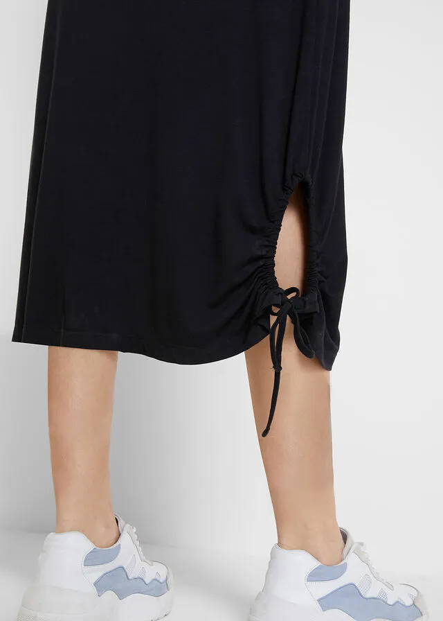 Vestido camisero midi con bolsillos laterales y detalle fruncido Negro